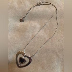 Silver tone heart necklace.